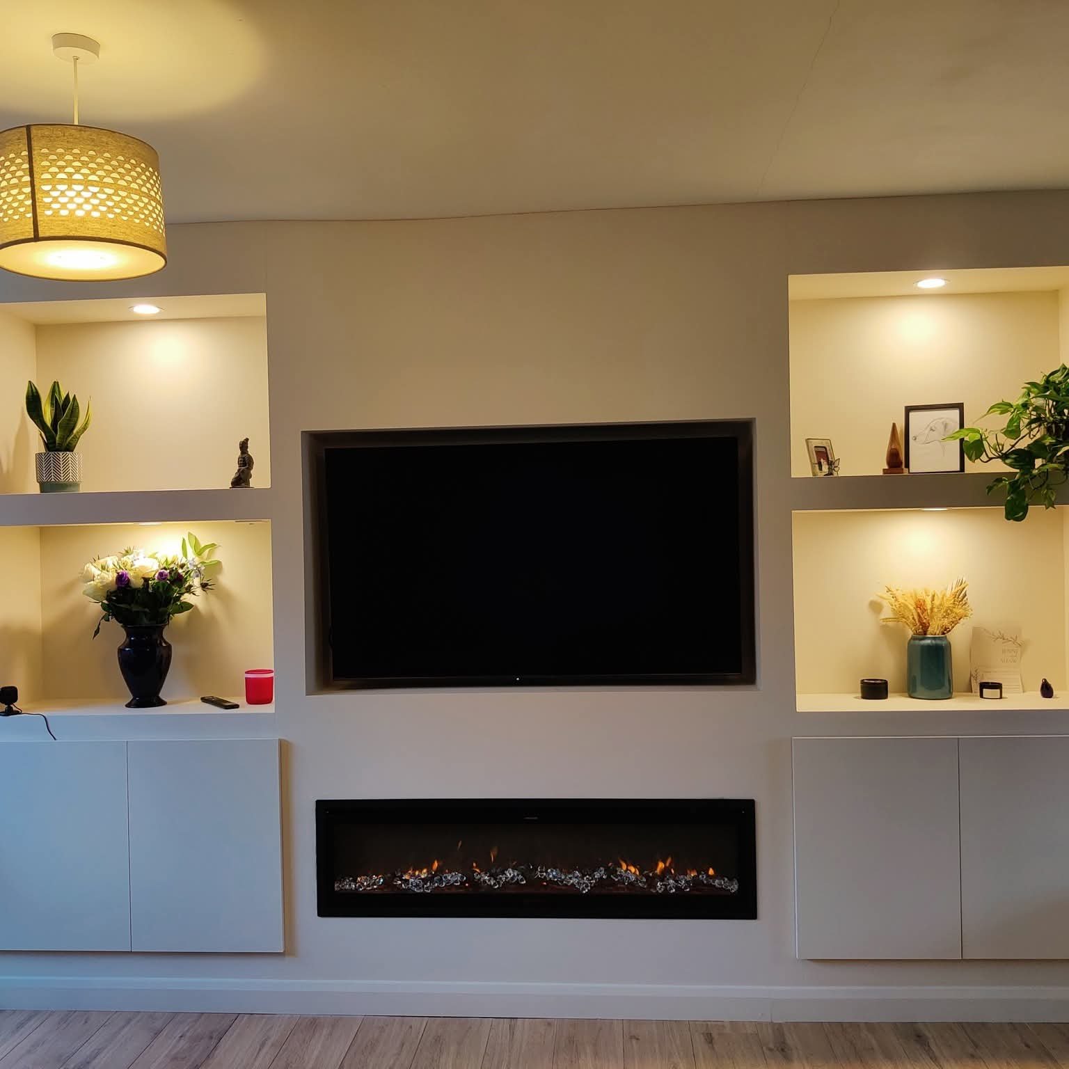 Full width media wall with alcove shelves and fireplace Manchester