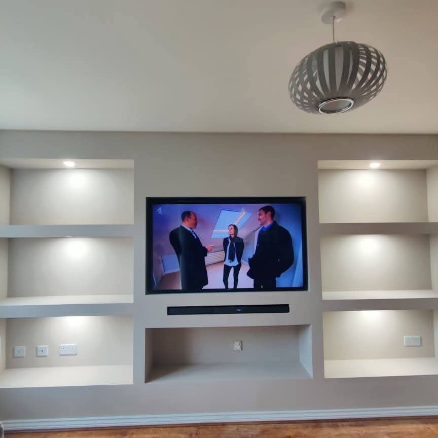 Illuminated alcove shelving media wall by Nexus Manchester